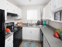 Sleek black appliances will inspire your inner chef - Array South Mountain Apartments in Phoenix, Arizona