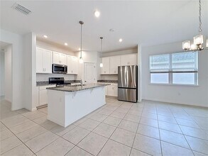 418 Quayside Ave in Mascotte, FL - Building Photo - Building Photo