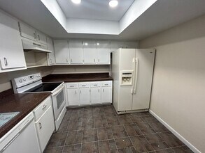 Freshly painted interior and new carpet in living room spacious home off Country Club Blvd in Cape Coral, FL - Building Photo - Building Photo