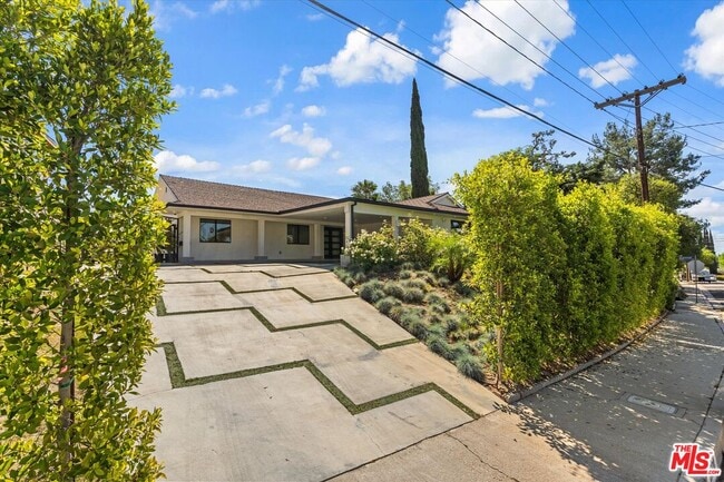 property at 11700 Woodley Ave