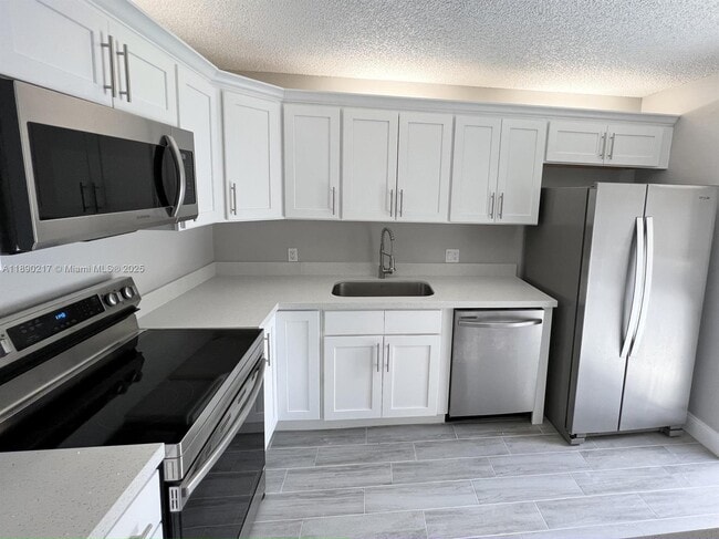 1415 14th Ct in Palm Beach Gardens, FL - Building Photo - Building Photo