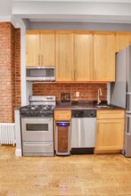 Perry Street in New York, NY - Building Photo - Building Photo