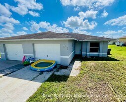 1135 Harry Ave S in Lehigh Acres, FL - Building Photo