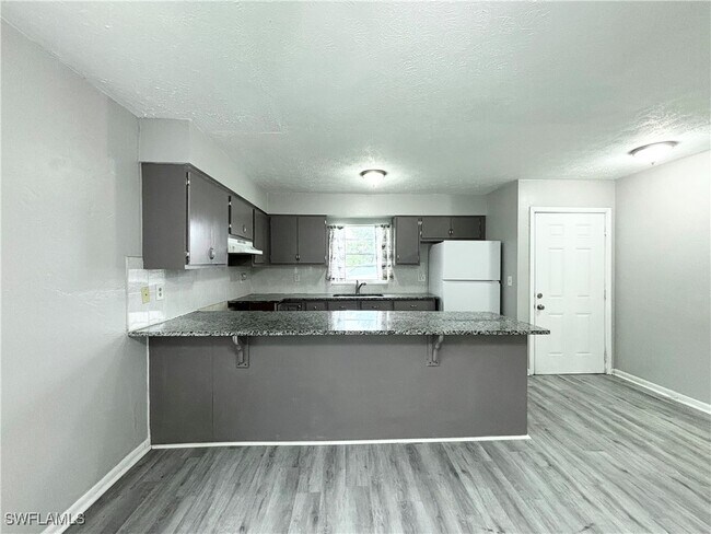 property at 1718 SW Santa Barbara Pl