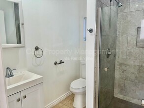 7053 Lindley Ave in Los Angeles, CA - Building Photo - Building Photo