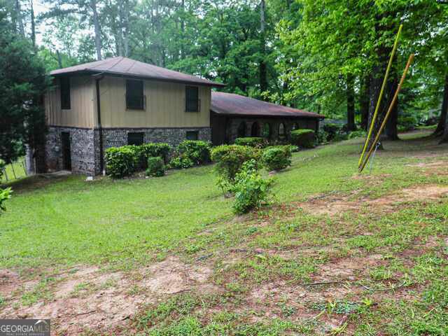property at 5935 Avenue of Redwoods SW