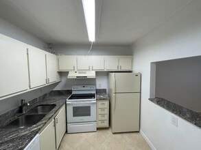 2100 Springdale Blvd, Unit 209 in Palm Springs, FL - Building Photo - Building Photo