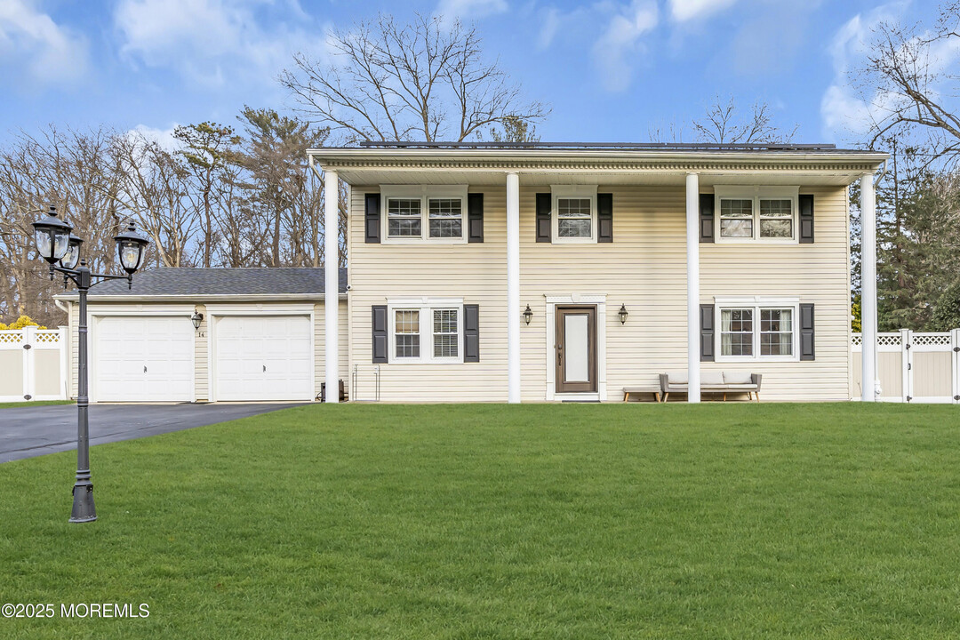 14 Regina Rd in Morganville, NJ - Building Photo