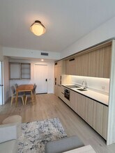 225 N Miami Ave, Unit SI FL25-ID1461461P in Miami, FL - Building Photo - Building Photo