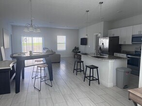 129 Lily Ln, Unit 3-112 in Poinciana, FL - Building Photo - Building Photo