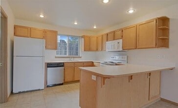 Bright Everett Home with 2-Car Garage in Everett, WA - Building Photo - Building Photo