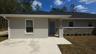 9093 N Peachtree Way in Citrus Springs, FL - Building Photo