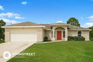 124 Gilbert Ave S in Lehigh Acres, FL - Building Photo