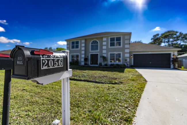 2056 SW Grant Ave in Port St. Lucie, FL - Building Photo - Building Photo