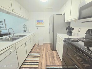 6903 N Lagoon Dr in Panama City, FL - Building Photo - Building Photo