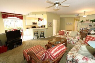 24833 Lakemont Cove Ln-Unit -104 in Bonita Springs, FL - Foto de edificio - Building Photo