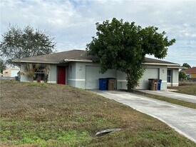 1125 Gilbert Ave S in Lehigh Acres, FL - Building Photo