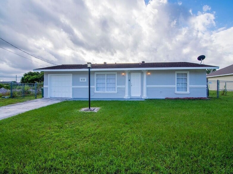 650 SE Evergreen Terrace, Unit 02O in Port St. Lucie, FL - Building Photo