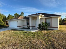 1238 Denver St E in Lehigh Acres, FL - Building Photo