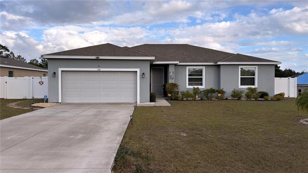 358 Hibiscus Dr in Poinciana, FL - Building Photo