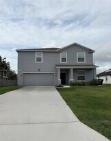 1557 SW Dycus Ave in Port St. Lucie, FL - Building Photo