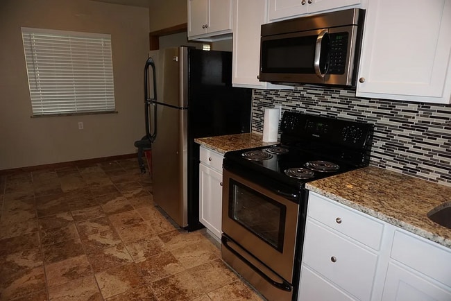 property at 5570-5580 W 10th Ave