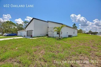 402 Oakland Ln in Poinciana, FL - Foto de edificio - Building Photo