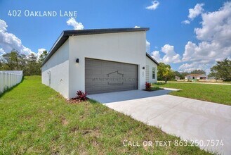 402 Oakland Ln in Poinciana, FL - Foto de edificio - Building Photo