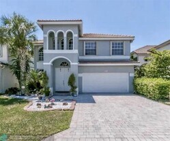 6911 Sea Daisy Dr in Atlantis, FL - Building Photo