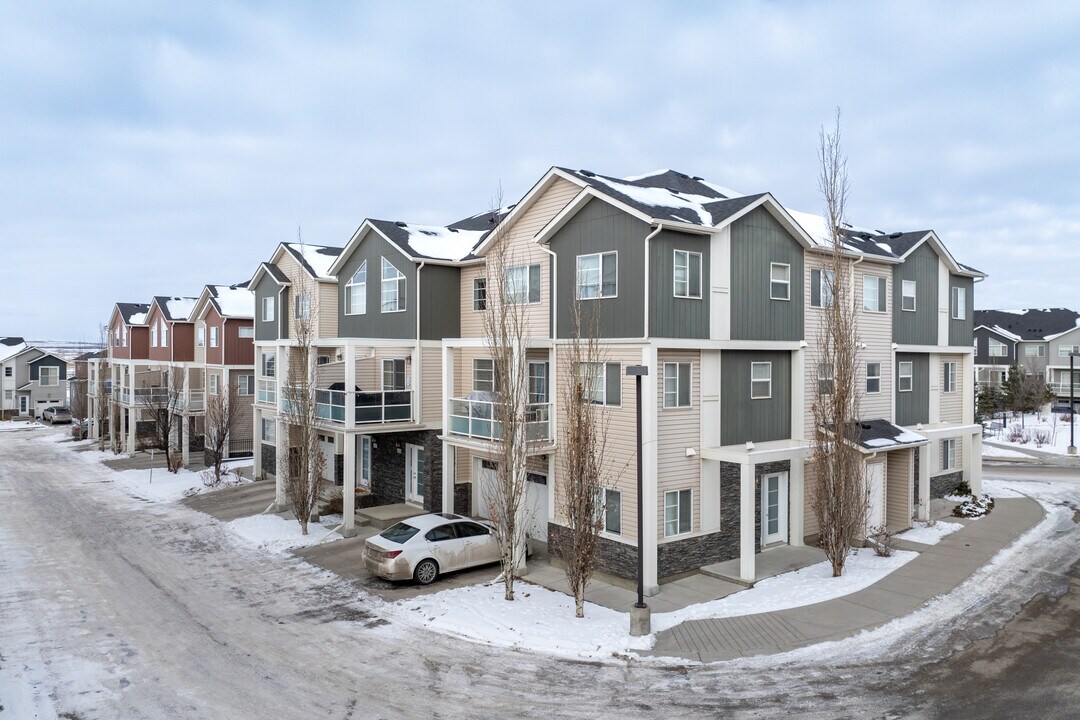 Arrive at Red Stone Way in Calgary, AB - Building Photo