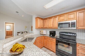 7667 N Wickham Rd, Unit 1419 in Melbourne, FL - Building Photo - Building Photo