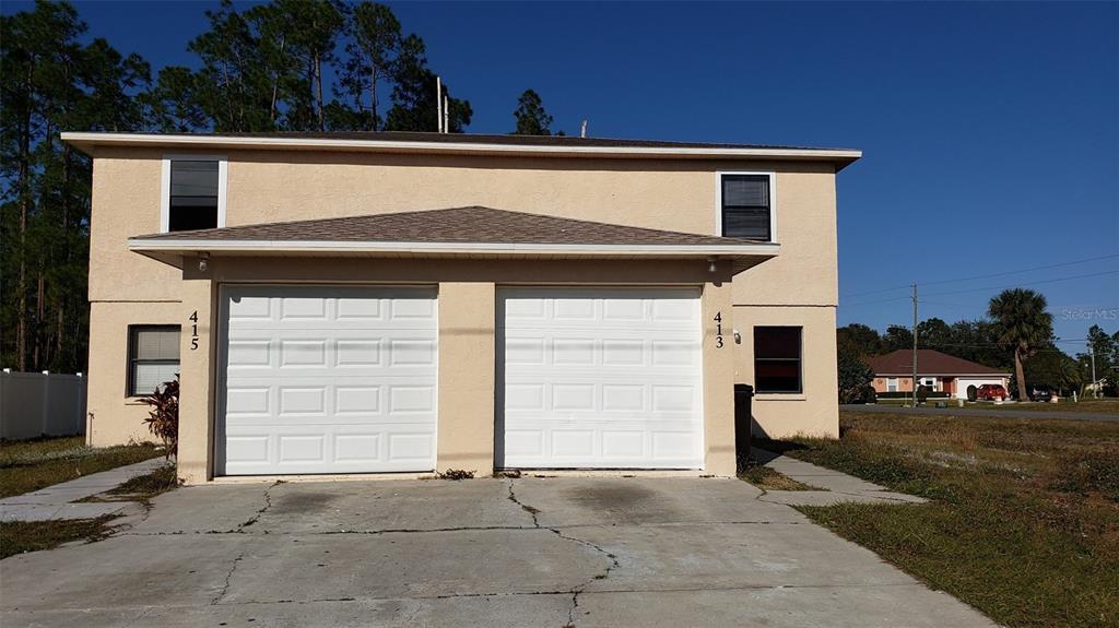 413-415 Greenwich Ct in Kissimmee, FL - Building Photo