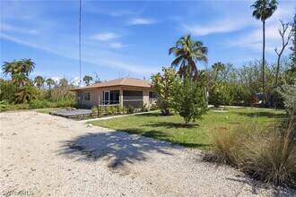 1046 Periwinkle Way in Sanibel, FL - Building Photo - Building Photo