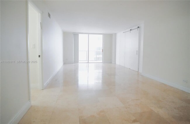 property at 6039 Collins Ave