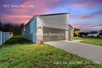 402 Oakland Ln in Poinciana, FL - Foto de edificio - Building Photo