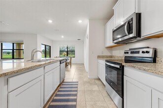 6295 NW Regent St in Port St. Lucie, FL - Building Photo - Building Photo