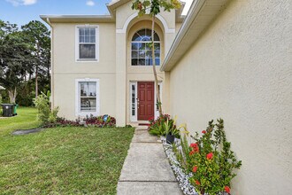 1676 SW Mackey Ave in Port St. Lucie, FL - Building Photo - Building Photo