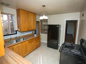 1395 N Harlan St in Lakewood, CO - Foto de edificio - Building Photo