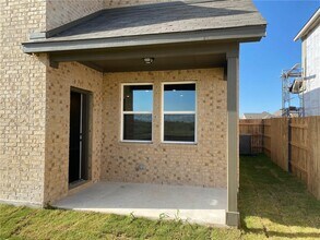 670 Pepperbark Loop in Mustang Ridge, TX - Building Photo - Building Photo