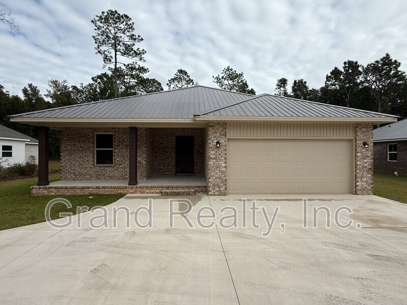 4886 E Spencer Field Rd in Pace, FL - Building Photo