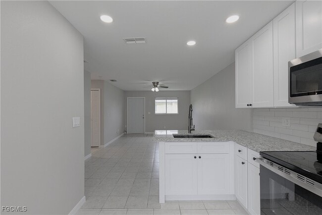 property at 427 NE Pine Island Ln