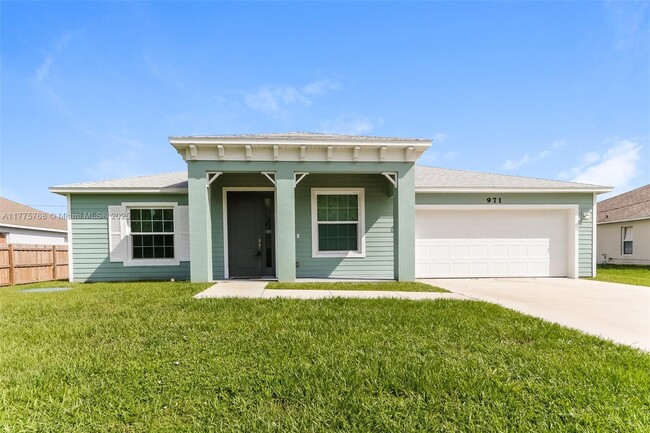 property at 971 SW McComkle Ave