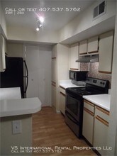 5587 Devonbriar Way-Unit -Unit J201 in Orlando, FL - Building Photo - Building Photo