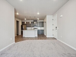 6153 N Ceylon St, Unit 10-303 in Denver, CO - Building Photo - Building Photo