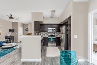 Open Kitchen and Living Room with Hardwood Floors - Oxmoor - Oxmoor Apartamentos in Louisville, Kentucky