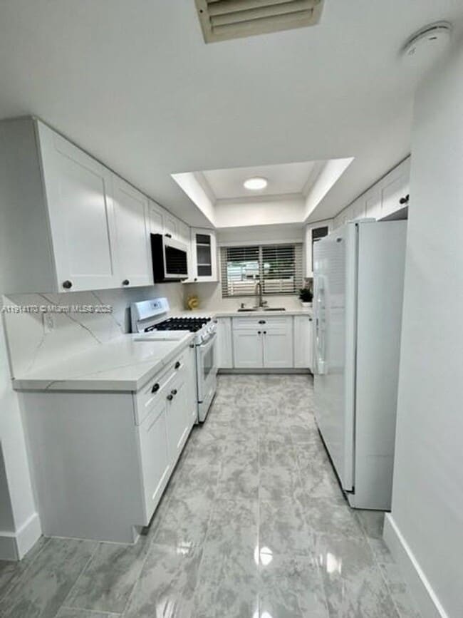 property at 7439 Twin Sabal Dr