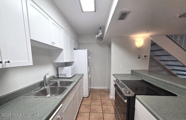 1407 Atlantic St in Melbourne Beach, FL - Building Photo - Building Photo