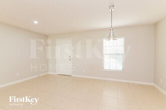 1876 Amber Sweet Cir in Dundee, FL - Building Photo - Building Photo