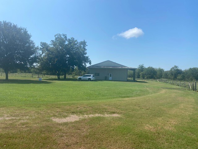 5729 Muske Ln in Pattison, TX - Building Photo