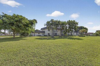 12001 Poinciana Blvd, Unit 204 in Royal Palm Beach, FL - Building Photo - Building Photo